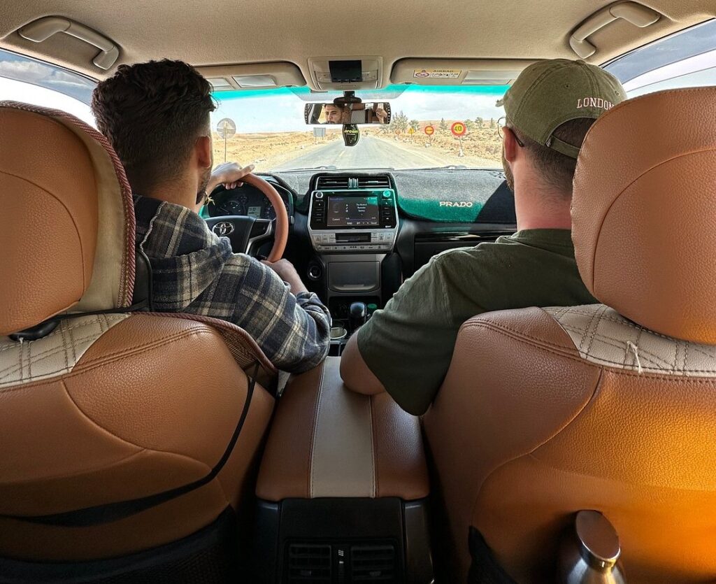Driver and passenger on the road in Morocco